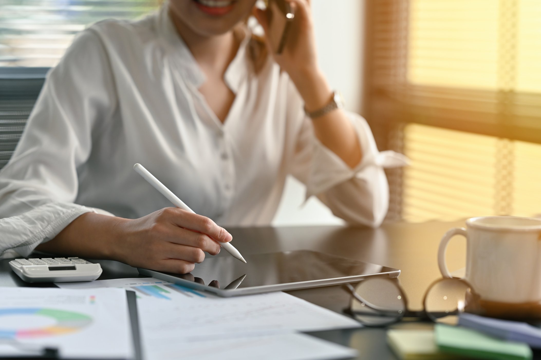 Close up of businesswoman talking about business plan and using